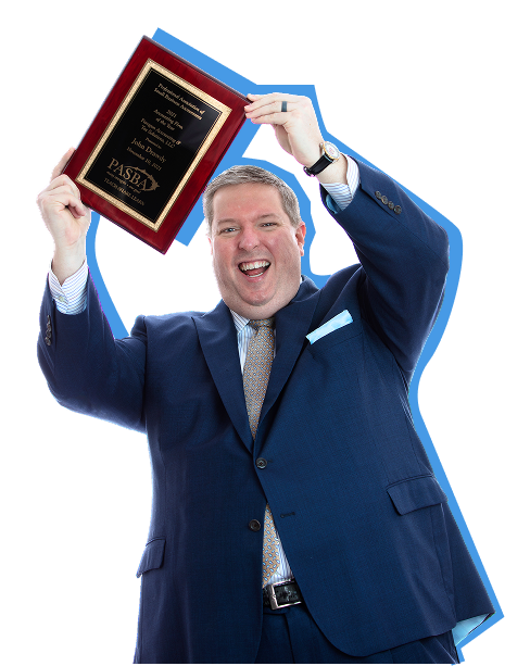 John Drawdy, owner of Paragon Accounting, holding the PASBA award won in 2021
